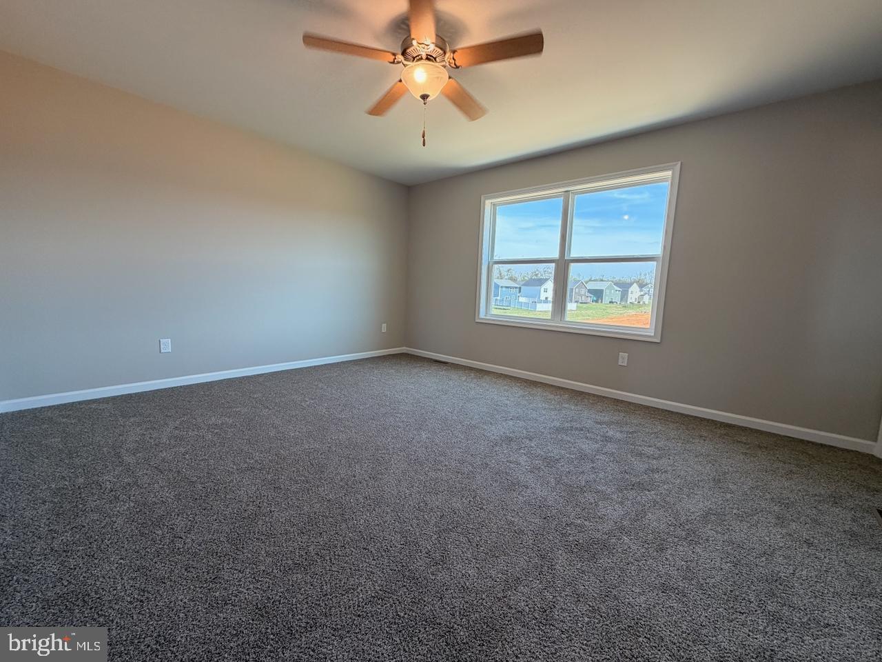 306 Rine Drive Shippensburg, PA 17257 - Photo 2 of 18 an empty room with windows and fan