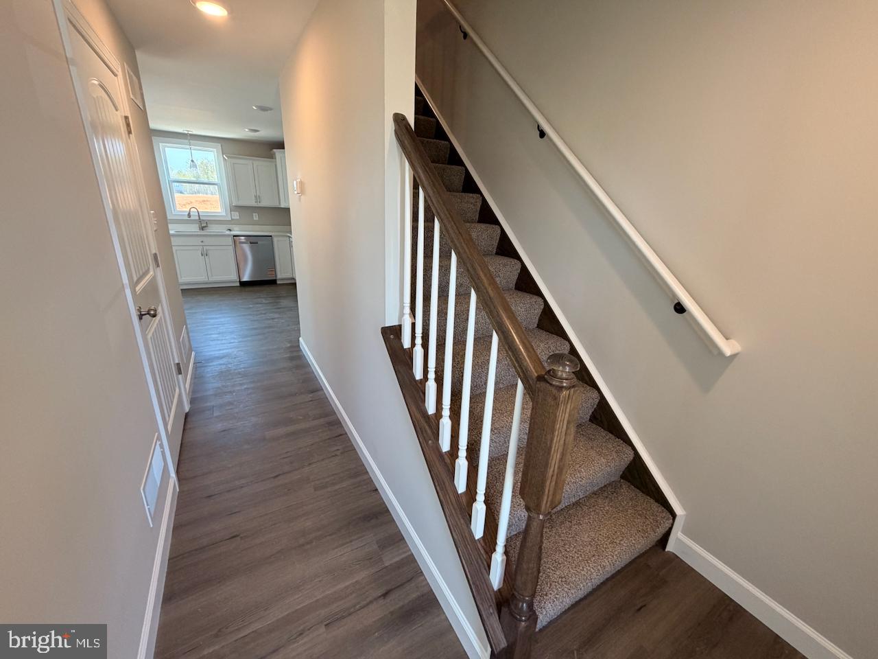 306 Rine Drive Shippensburg, PA 17257 - Photo 4 of 18 a view of a hallway with wooden floor and staircase
