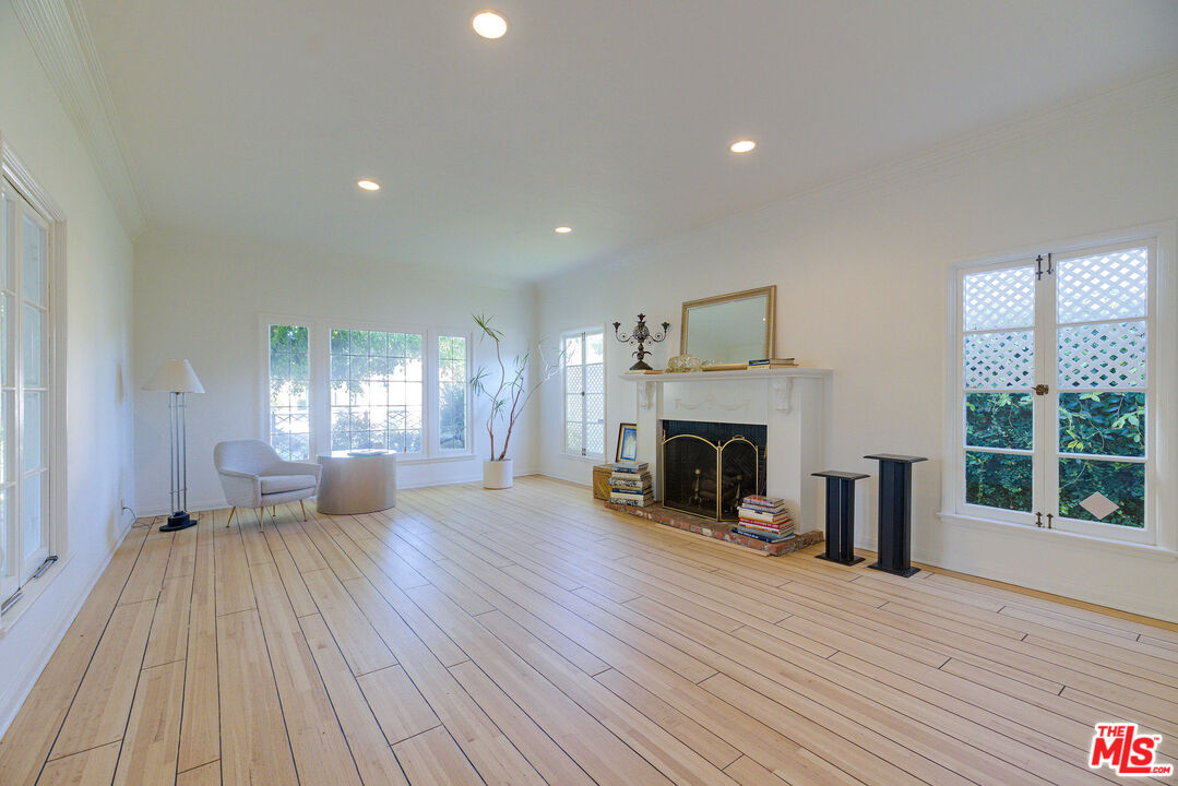 455 South Hamel Road Los Angeles, CA 90048 - Photo 11 of 31 a view of a livingroom with wooden floor and a fireplace