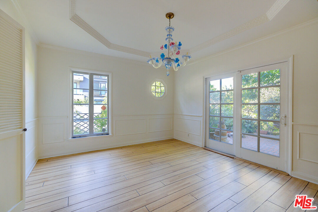 455 South Hamel Road Los Angeles, CA 90048 - Photo 17 of 31 wooden floor in an empty room with a window
