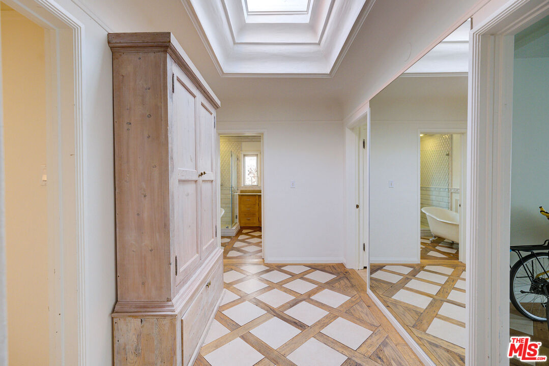 455 South Hamel Road Los Angeles, CA 90048 - Photo 20 of 31 a view of a bedroom with a bed and wooden floor