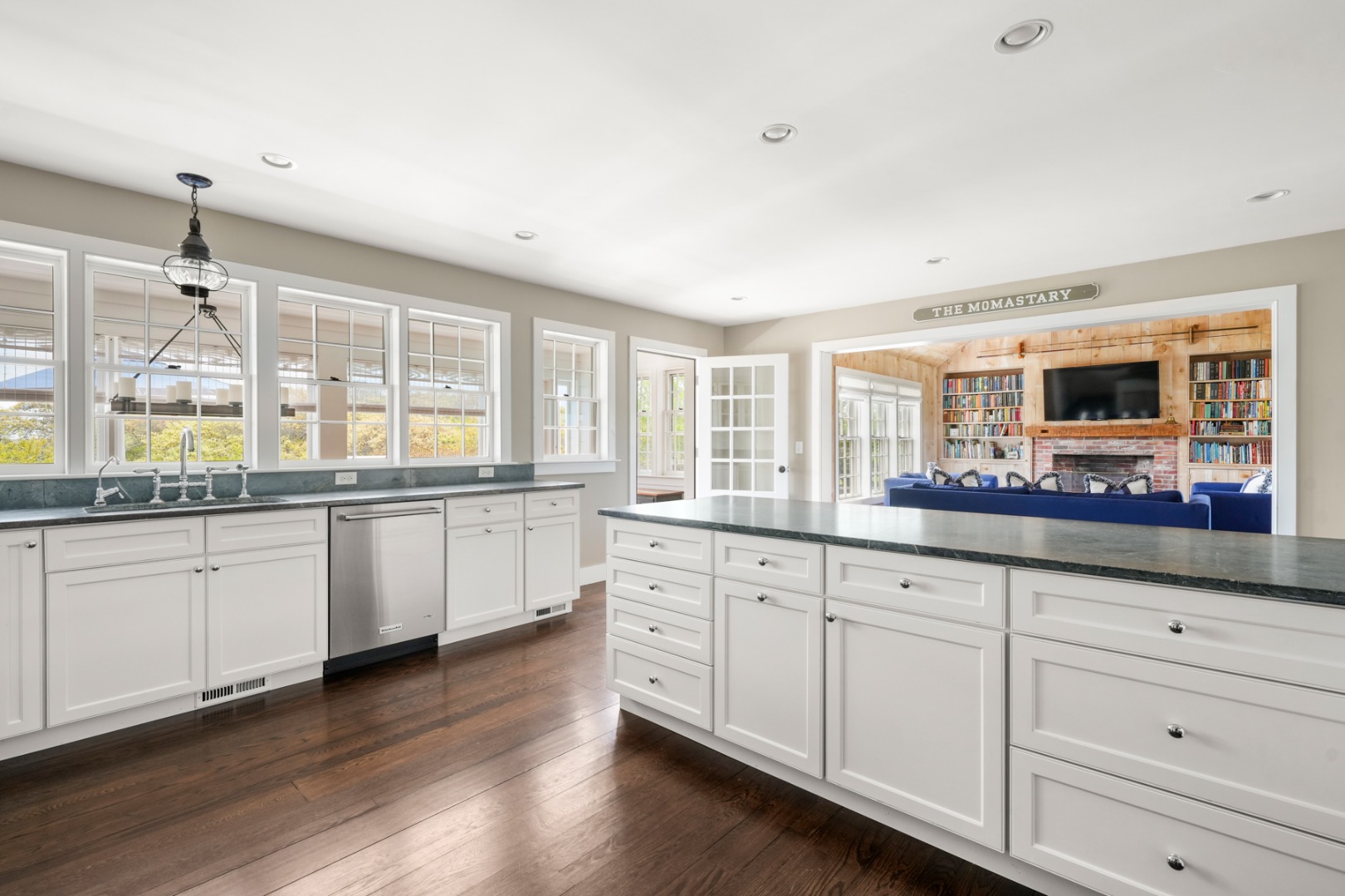 21 Quidnet Road Nantucket, MA 02554 - Photo 37 of 62 a large kitchen with granite countertop a large window and white appliances