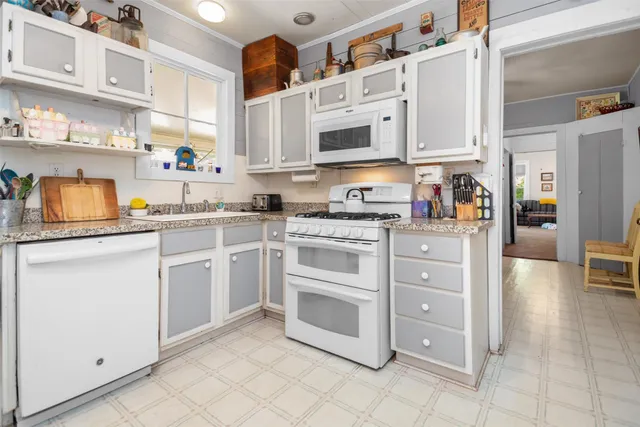 a kitchen with stainless steel appliances cabinets and a sink