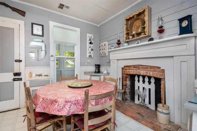 a bedroom with a bed and a fireplace