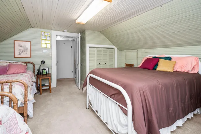 a bedroom with a bed and a table