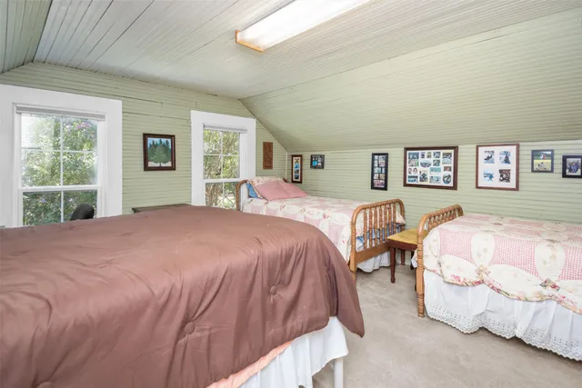 a spacious bedroom with a bed and window