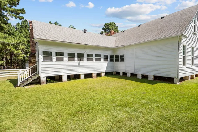 a view of a house with a swimming pool