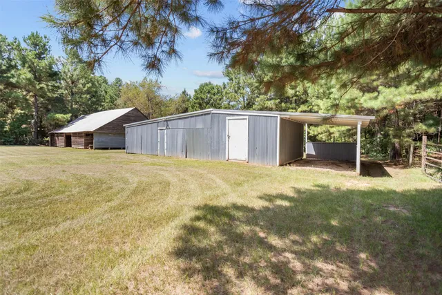 a house with trees in the background