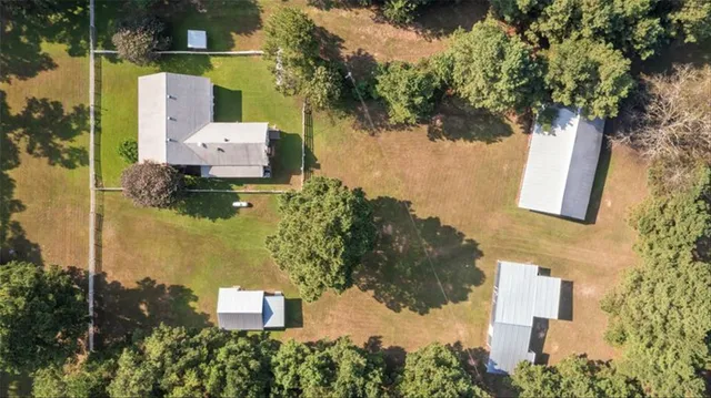 aerial view of a house with a yard
