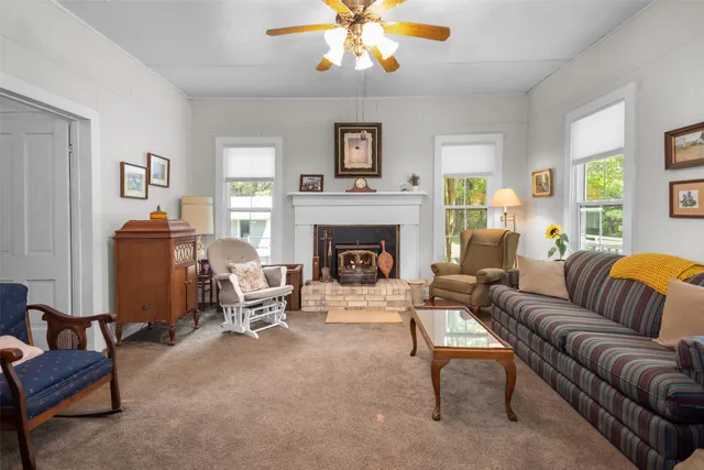 a living room with furniture and a fireplace
