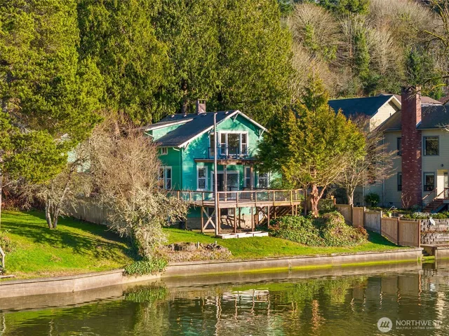 a front view of a house with a yard table and chairs