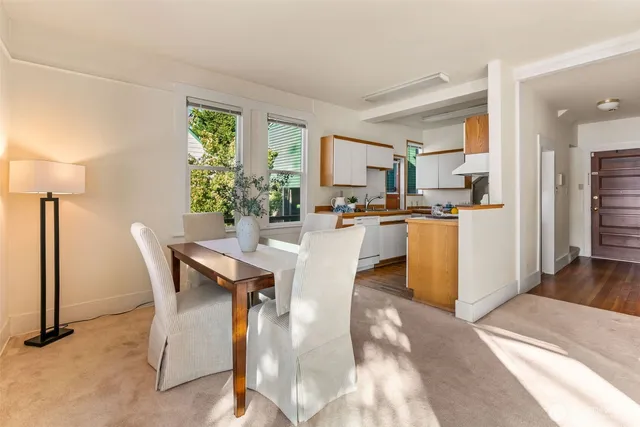 a view of a dining room with furniture window and outside view