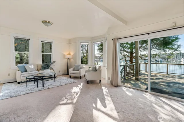a kitchen with kitchen island a sink a stove and a refrigerator
