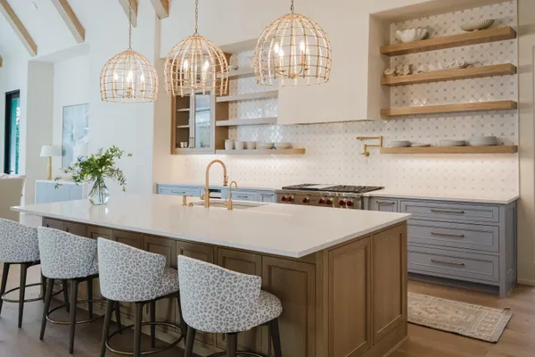 a stove top oven sitting inside of a kitchen
