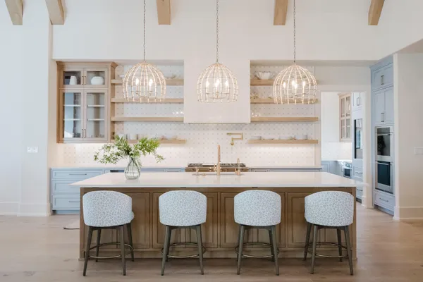 a kitchen with granite countertop a stove and a cabinet