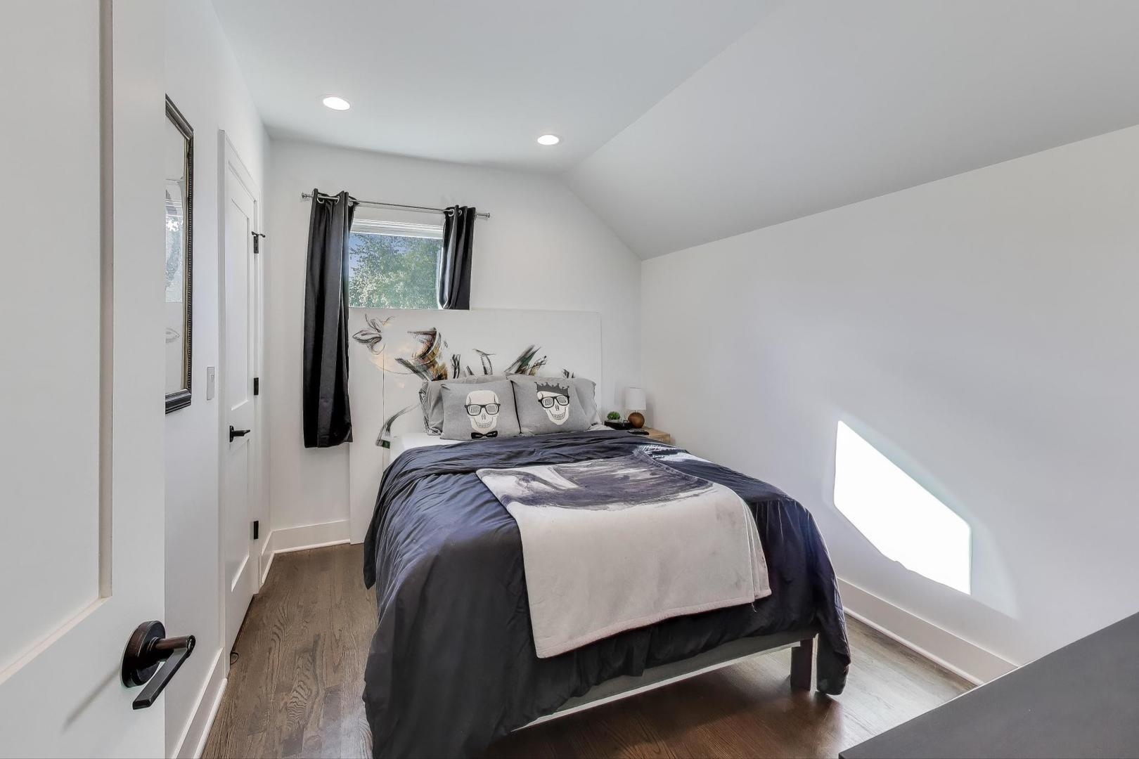 4438 North Spaulding Avenue Chicago, IL 60625 - Photo 20 of 40 a bedroom with a bed and a mirror