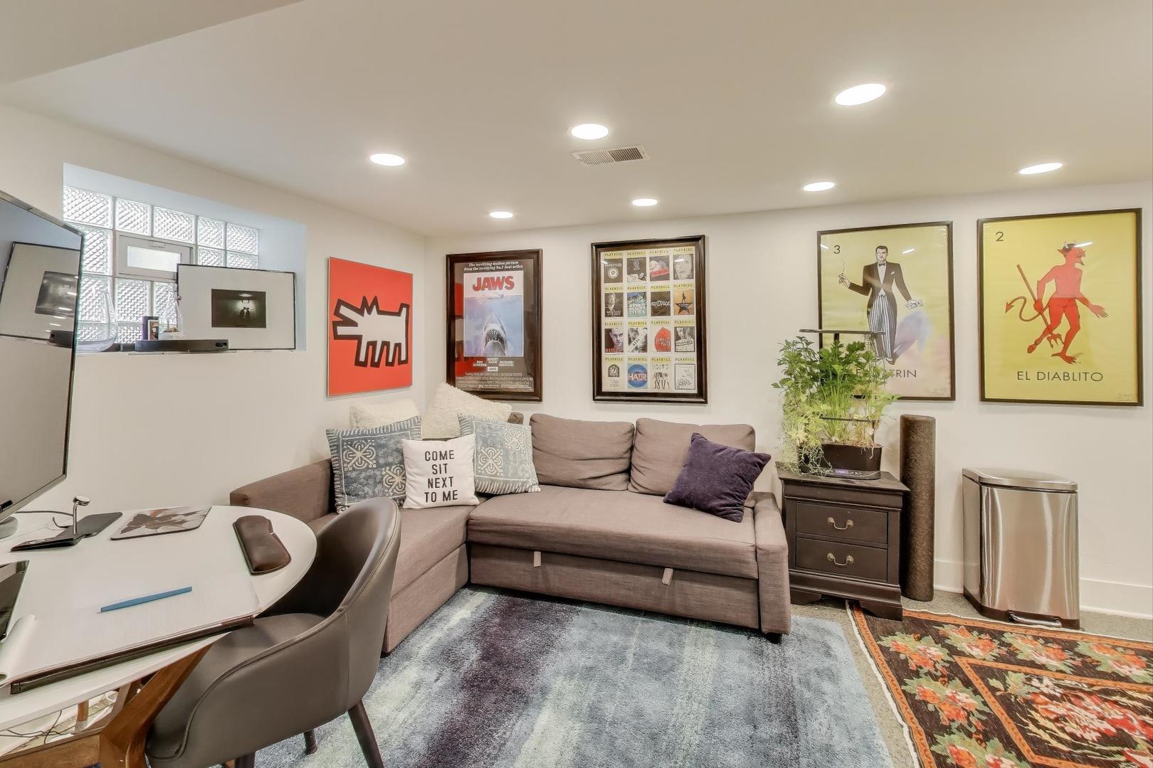 4438 North Spaulding Avenue Chicago, IL 60625 - Photo 25 of 40 a living room with furniture and a flat screen tv