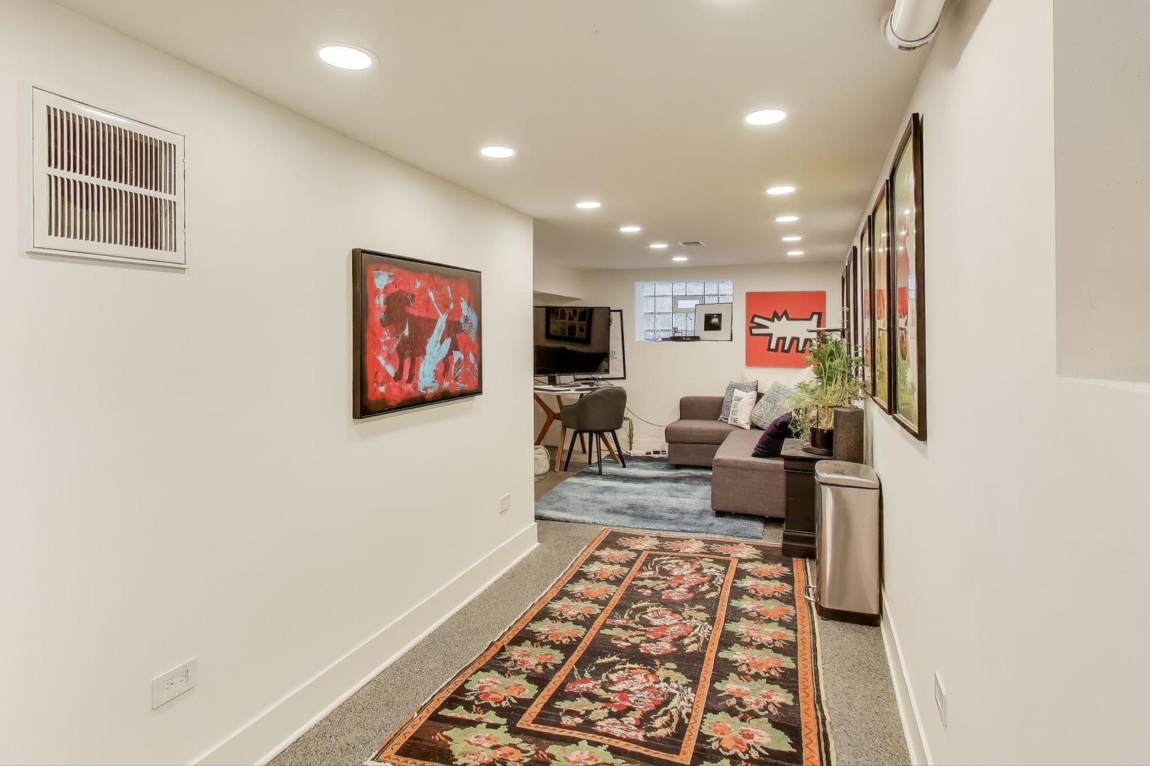 4438 North Spaulding Avenue Chicago, IL 60625 - Photo 27 of 40 a living room with furniture and a flat screen tv