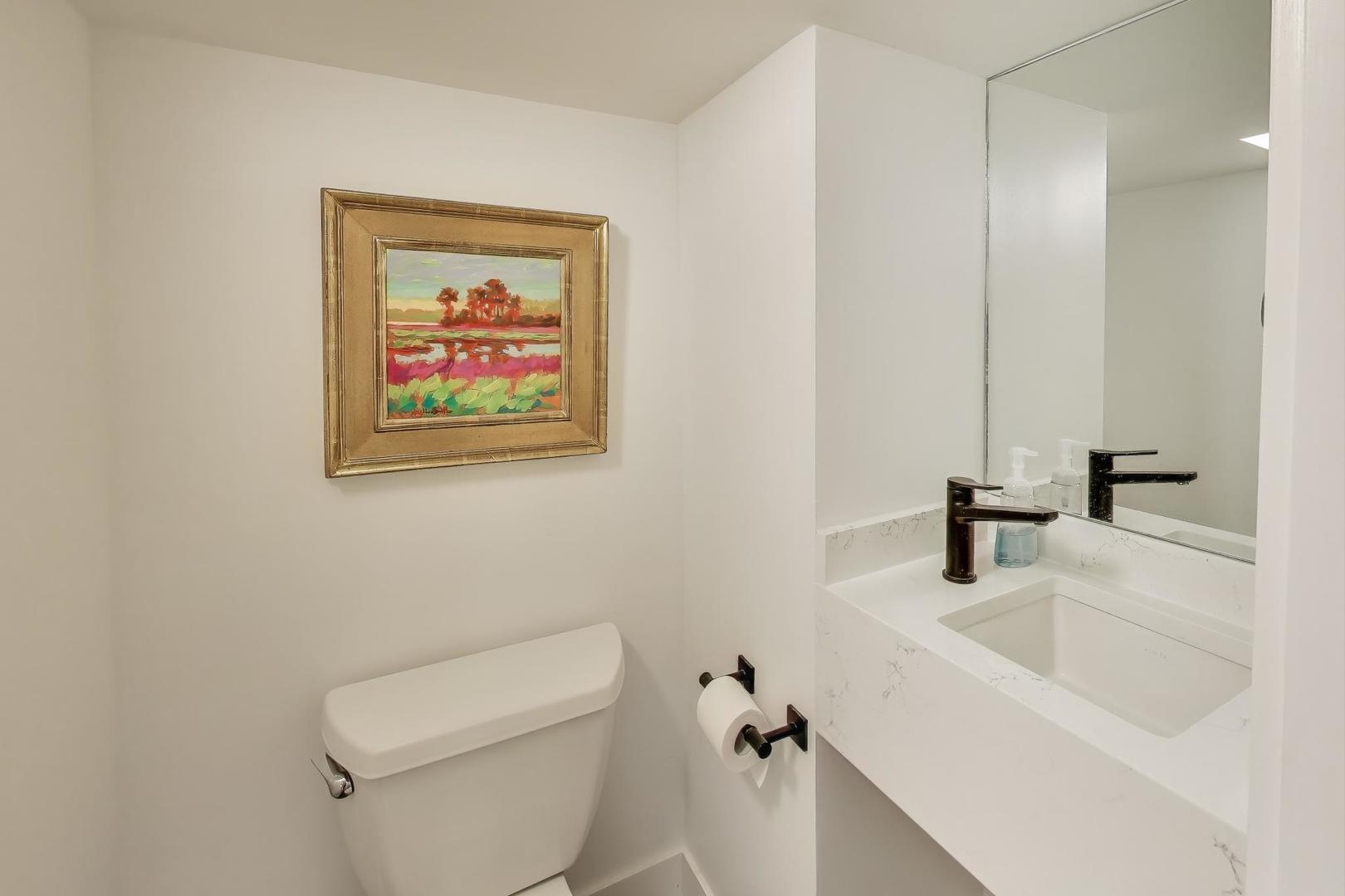 4438 North Spaulding Avenue Chicago, IL 60625 - Photo 28 of 40 a bathroom with a sink a toilet and mirror