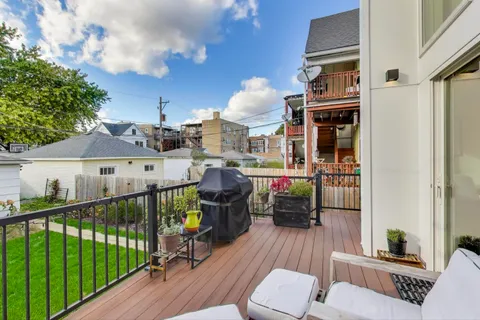 a view of a balcony with furniture