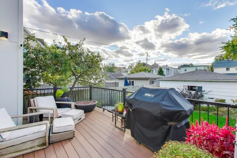 a view of house with outdoor seating area