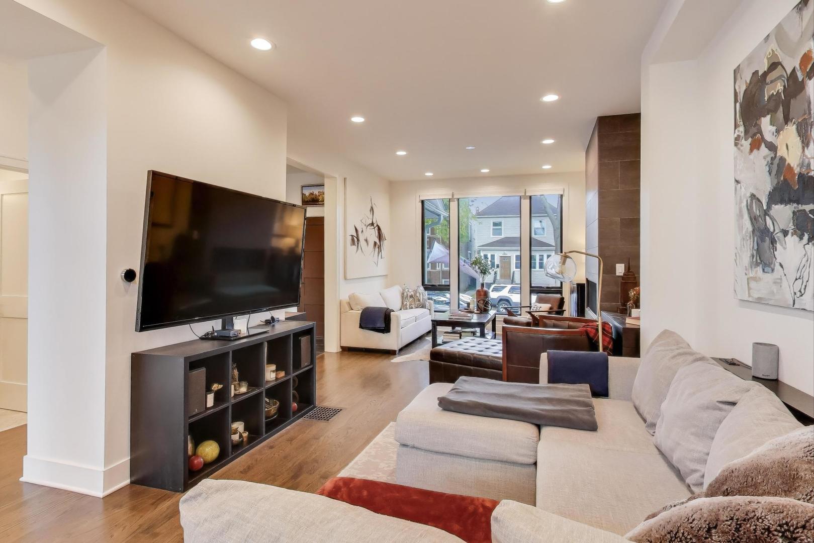 4438 North Spaulding Avenue Chicago, IL 60625 - Photo 8 of 40 a living room with furniture and a flat screen tv