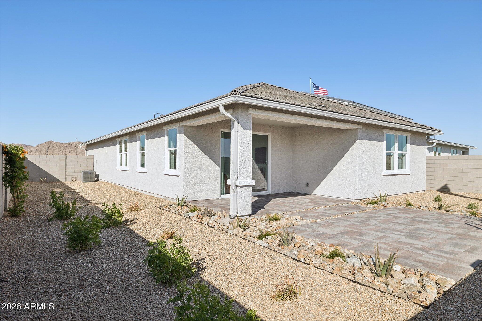 26449 West Crown King Road Buckeye, AZ 85326 - Photo 30 of 33 a view of white house with a yard