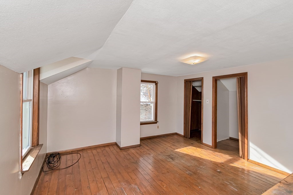 12 Cherry Street Westfield, MA 01085 - Photo 11 of 11 an empty room with closet and windows