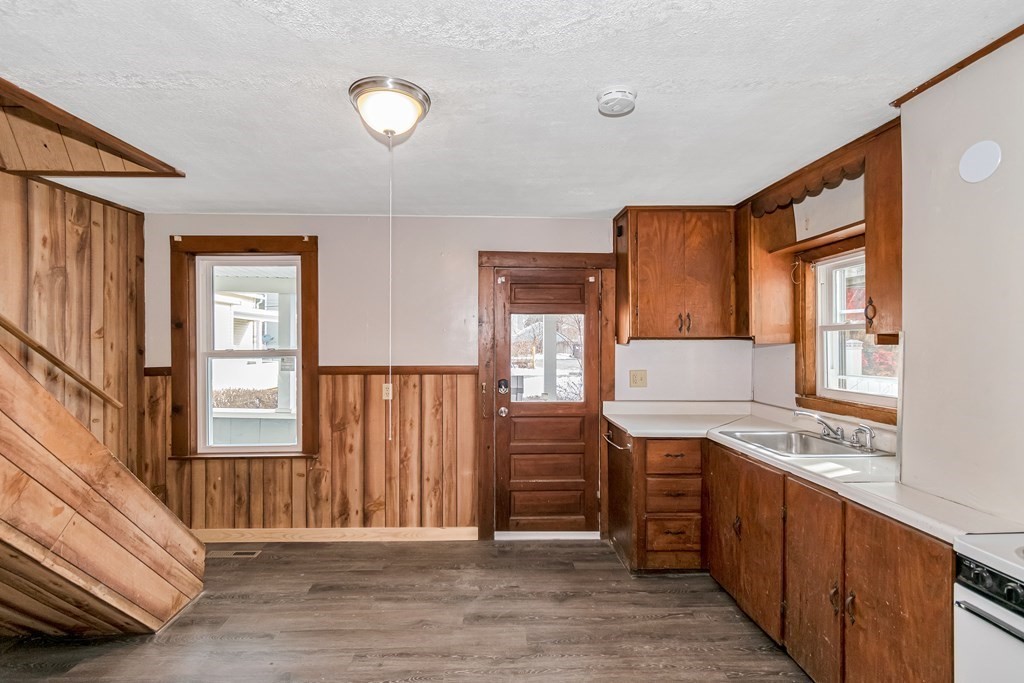 12 Cherry Street Westfield, MA 01085 - Photo 5 of 11 a kitchen with stainless steel appliances granite countertop a stove a sink and a refrigerator