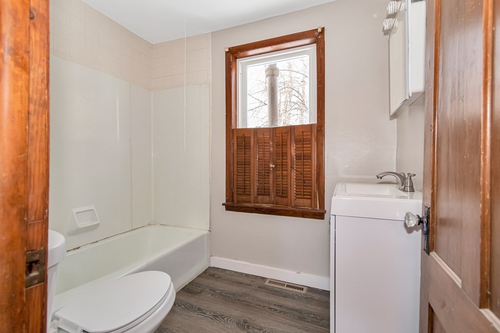 12 Cherry Street Westfield, MA 01085 - Photo 6 of 11 a bathroom with sink toilet and shower