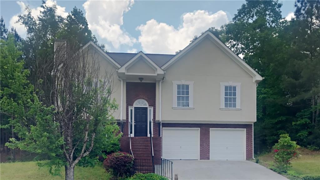 913 Palmer Road Lithonia, GA 30058 - Photo 1 of 1 a front view of a house with garden