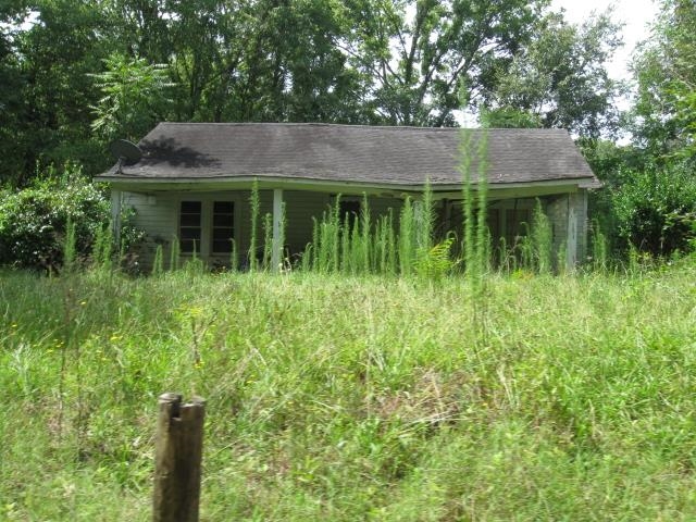 291 Mcgee Road Ramer, TN 37367 - Photo 2 of 9 a view of a house with a yard and plants