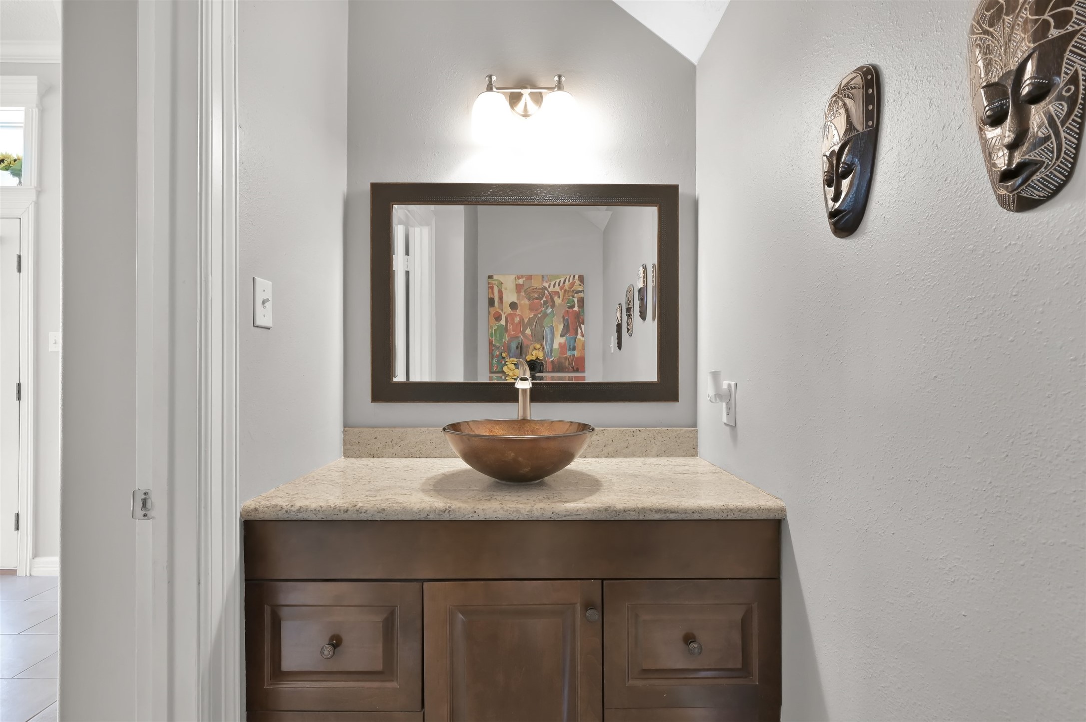 9706 Chipstead Court Spring, TX 77379 - Photo 13 of 44 Centrally located on the first floor is a stylish half bath for guests to use while you entertain.