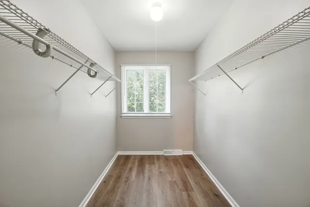 a view of room with window and hardwood floor