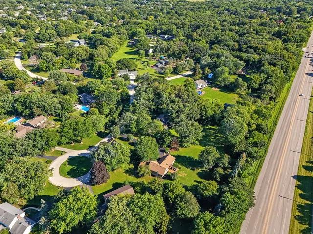 an aerial view of residential houses with outdoor space
