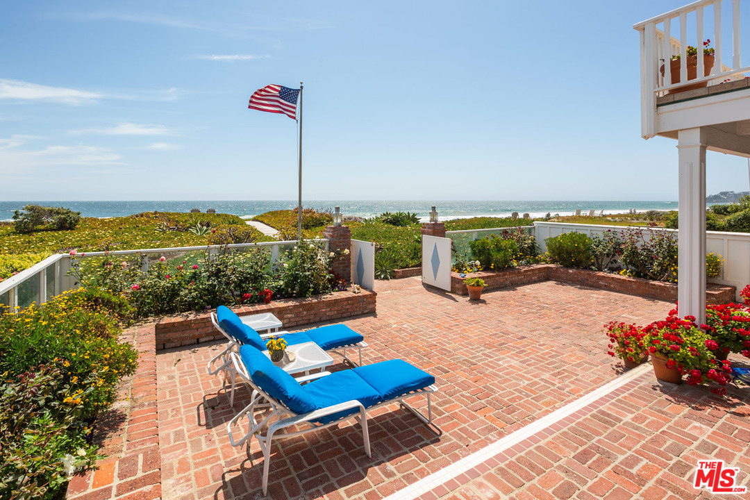 31026 Broad Beach Road Malibu, CA 90265 - Photo 2 of 40 a view of swimming pool with a lounge chairs
