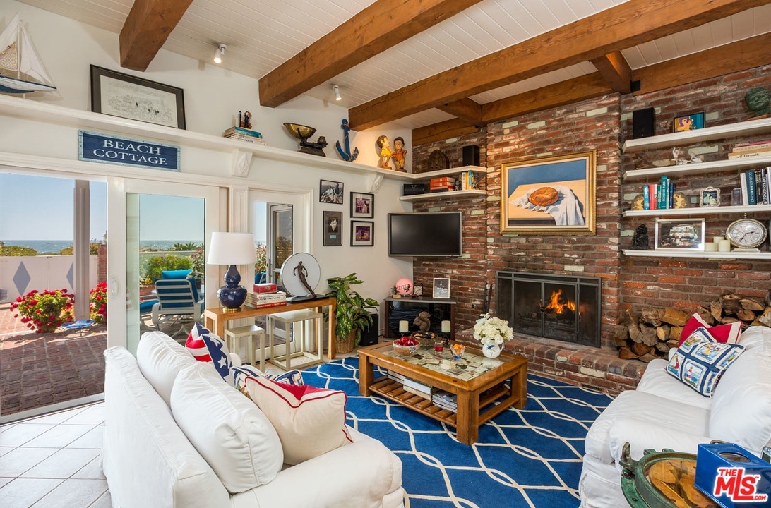 31026 Broad Beach Road Malibu, CA 90265 - Photo 15 of 40 a outdoor living space with furniture and a fireplace