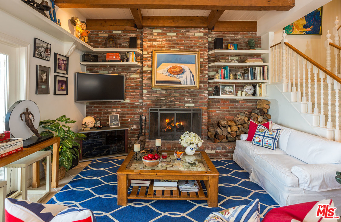31026 Broad Beach Road Malibu, CA 90265 - Photo 16 of 40 a living room with fireplace furniture and a flat screen tv