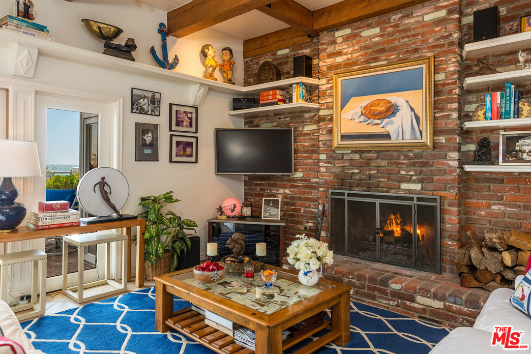 31026 Broad Beach Road Malibu, CA 90265 - Photo 17 of 40 a living room with fireplace furniture and a flat screen tv