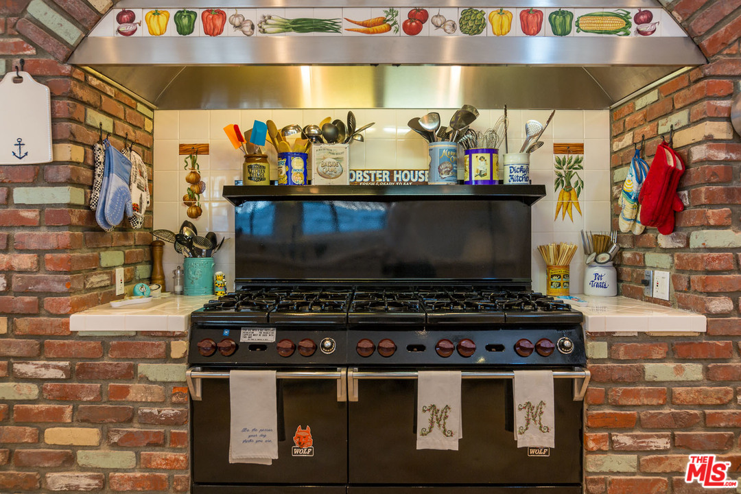 31026 Broad Beach Road Malibu, CA 90265 - Photo 22 of 40 a stove top oven sitting inside of a kitchen