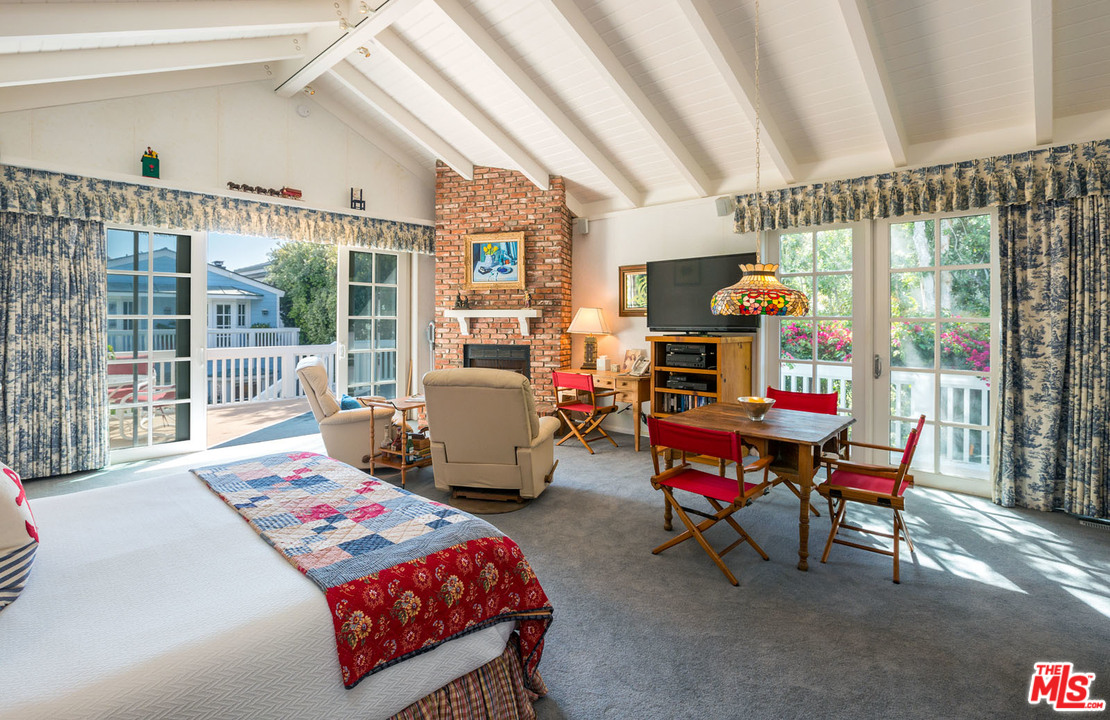 31026 Broad Beach Road Malibu, CA 90265 - Photo 24 of 40 a bedroom with furniture and a large window