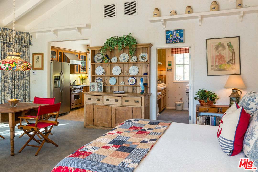 31026 Broad Beach Road Malibu, CA 90265 - Photo 25 of 40 a bedroom with a bed and furniture