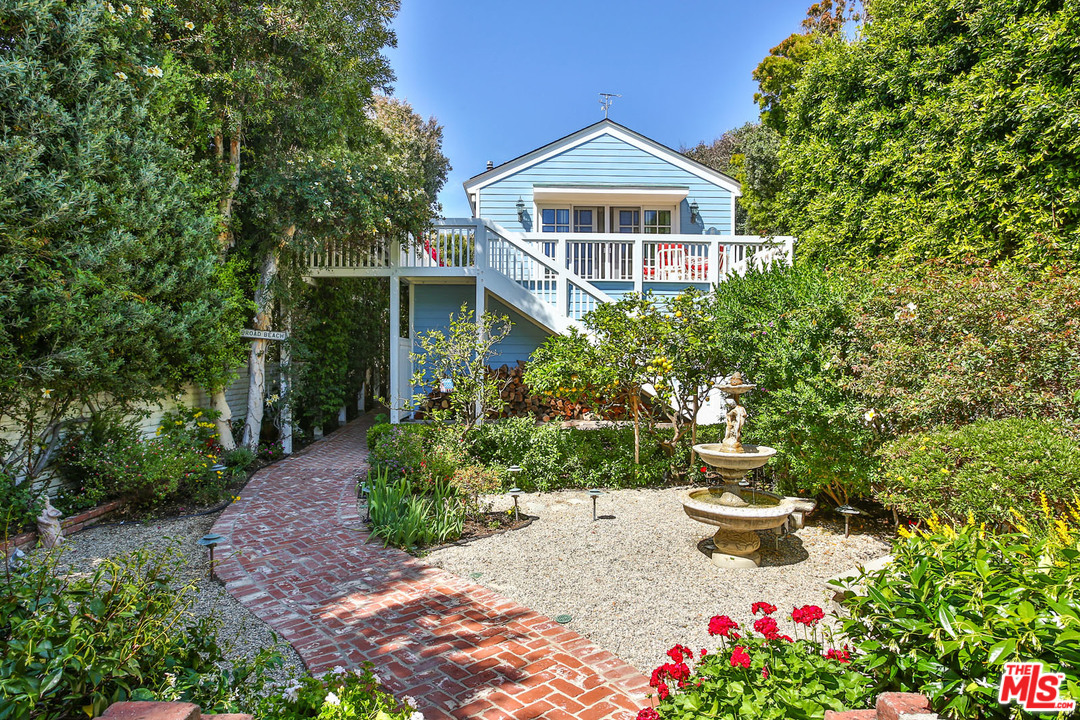 31026 Broad Beach Road Malibu, CA 90265 - Photo 34 of 40 a front view of a house with a yard