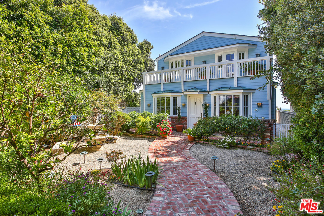 31026 Broad Beach Road Malibu, CA 90265 - Photo 35 of 40 a front view of a house with a yard