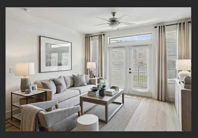 a living room with furniture and a window