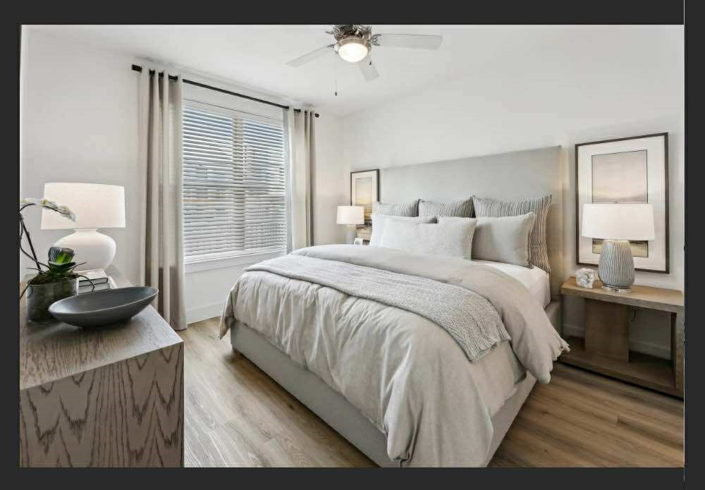 4000 Anserra Trail, Unit C Katy, TX 77494 - Photo 5 of 10 a bedroom with a bed and window