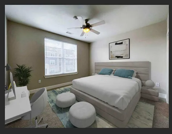 a bedroom with a bed and window