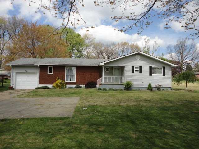 289 Baker Street Rimersburg, PA 16248 - Photo 1 of 1 a view of a yard in front of a house with plants and large tree
