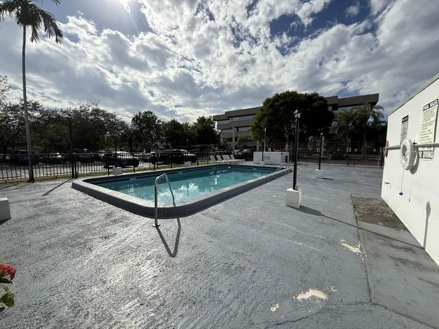 a kitchen with a sink cabinets and window