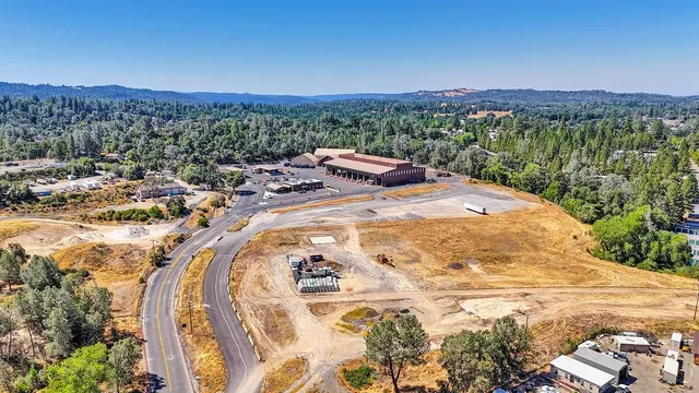 a view of a swimming pool with a table and chairs